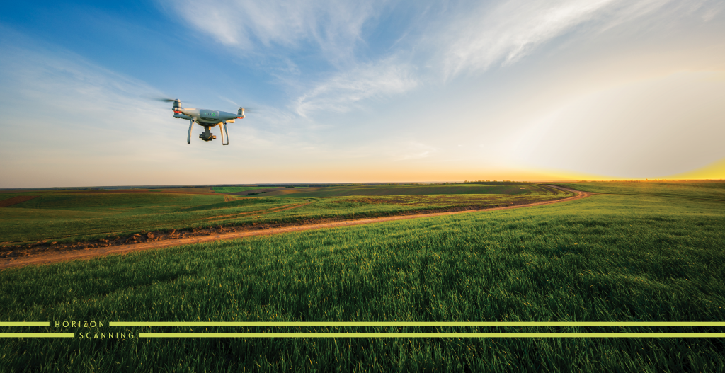 drone flying over field