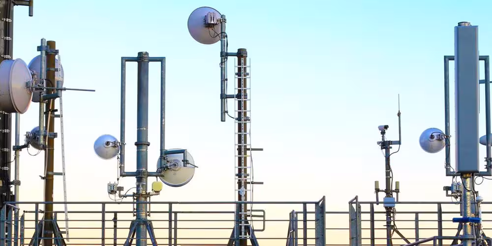 Satellite dishes and cameras on a rooftop